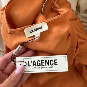 Orange maxi slip dress. Can fit sizes XS/S/M
Has pockets!